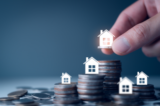 Foto: Münzen und Haus-Icons